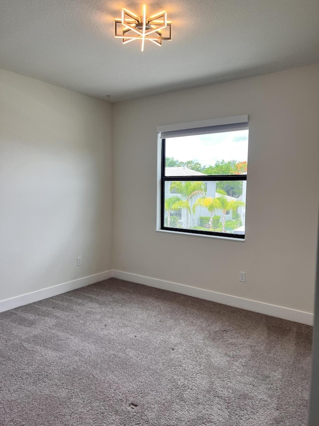 unfurnished room with carpet floors