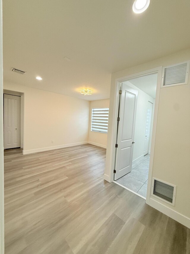 clothes washing area with separate washer and dryer and light tile patterned floors