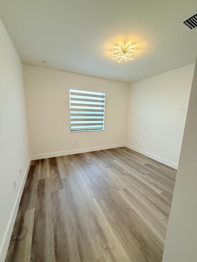 bathroom featuring tiled shower, vanity, and tile patterned flooring