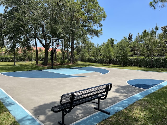 view of basketball court featuring a yard