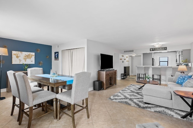 dining area with light tile patterned flooring