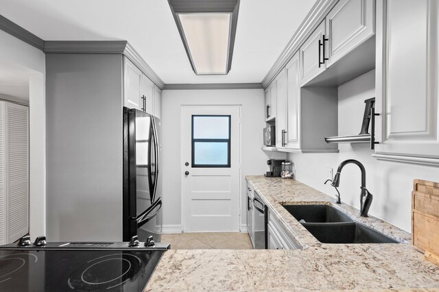 kitchen with crown molding, white cabinetry, stainless steel appliances, and sink