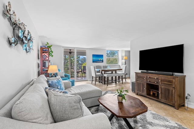 tiled living room featuring ceiling fan