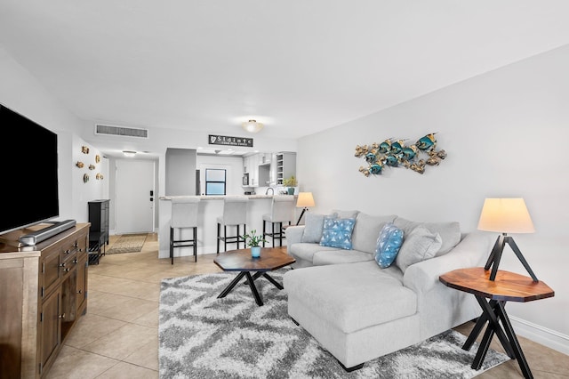 living room with light tile patterned floors