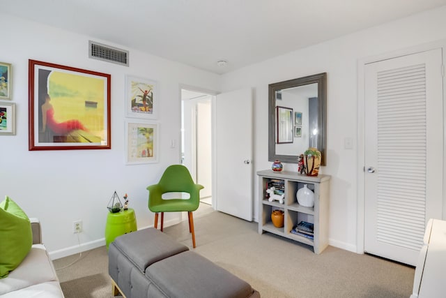 living room with light colored carpet