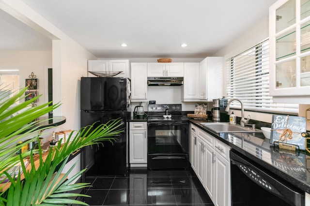 kitchen with sink, white cabinets, and black appliances