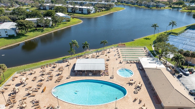 birds eye view of property featuring a water view