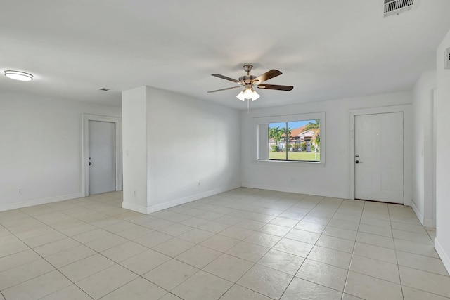 unfurnished room featuring ceiling fan and light tile patterned floors