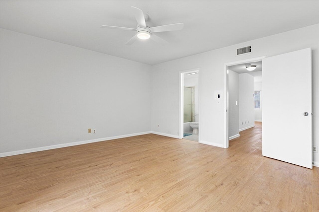 empty room with ceiling fan and light hardwood / wood-style flooring