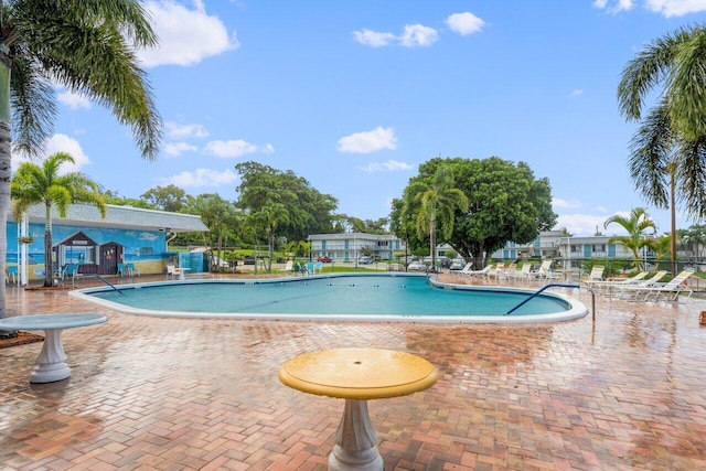 view of swimming pool featuring a patio