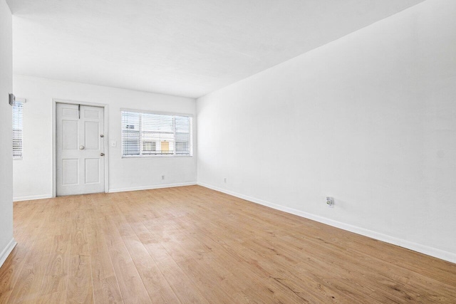 empty room with light hardwood / wood-style floors