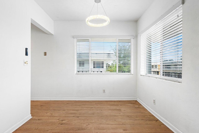 spare room with hardwood / wood-style flooring