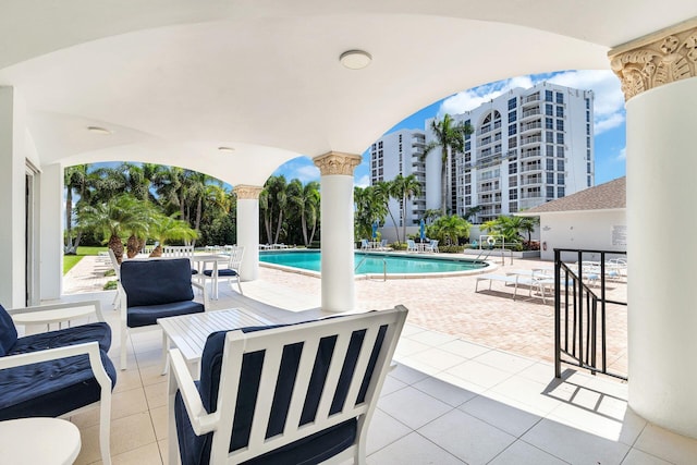 view of swimming pool with a patio