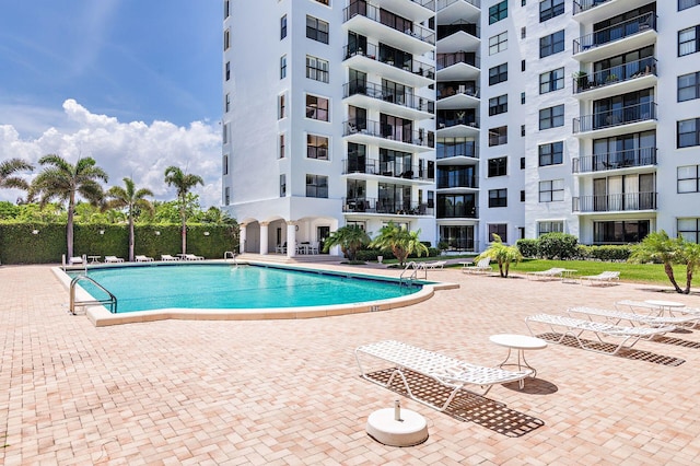 view of pool featuring a patio area