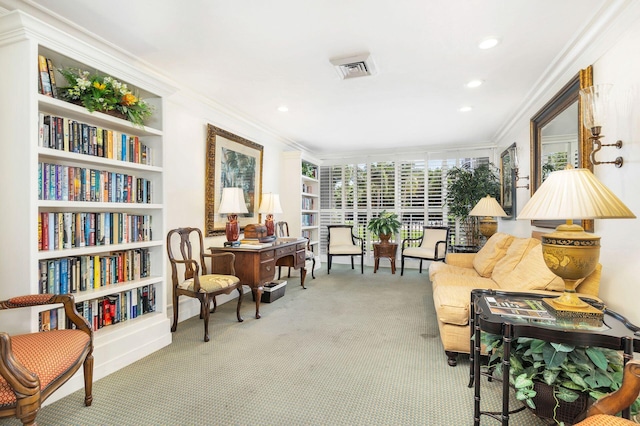 living area with carpet flooring, built in features, and ornamental molding