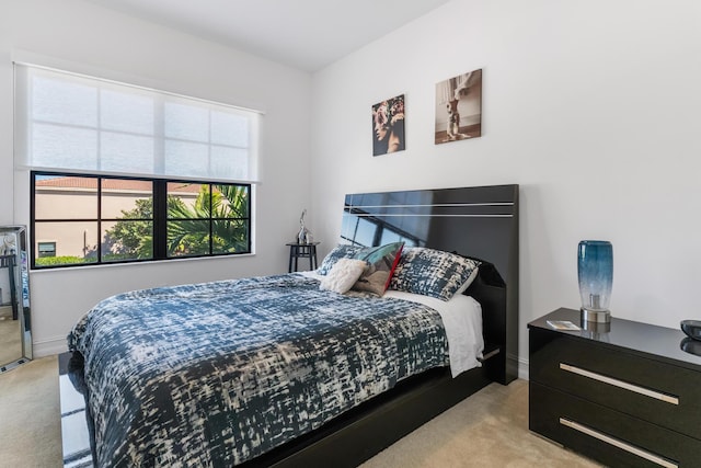 bedroom with light colored carpet