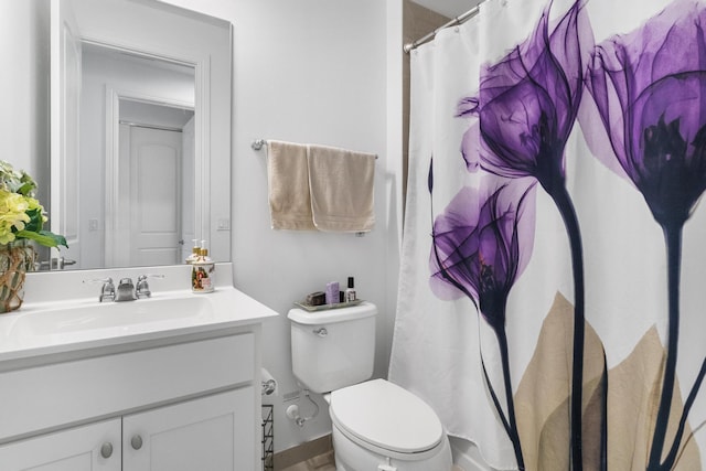 bathroom featuring vanity and toilet