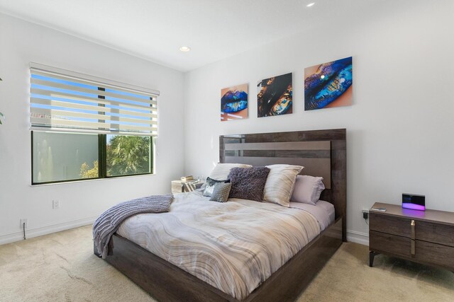 carpeted bedroom featuring a crib