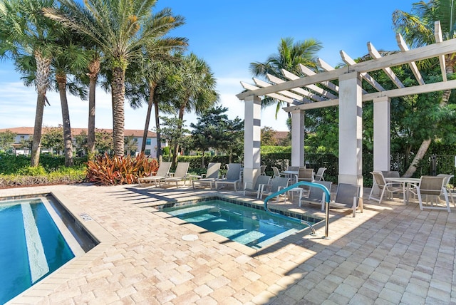 view of swimming pool featuring a pergola and a patio