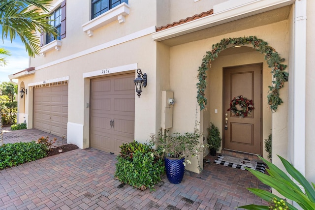 entrance to property featuring a garage