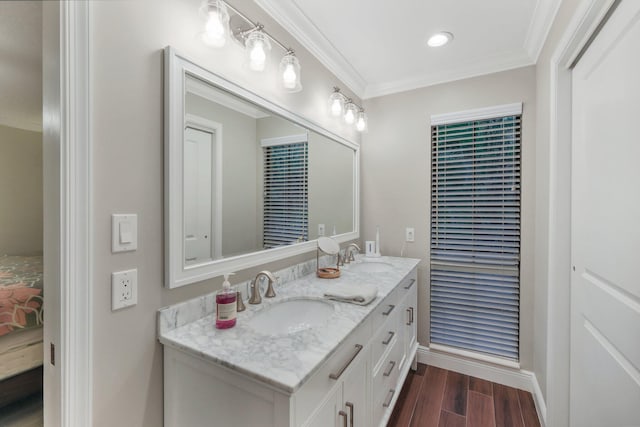 bathroom with vanity and ornamental molding