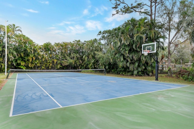 view of sport court with basketball hoop