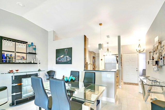 6140 Kings Gate Cir, Delray Beach, FL 33484 - dining room with baseboards, light tile patterned floors, and a chandelier