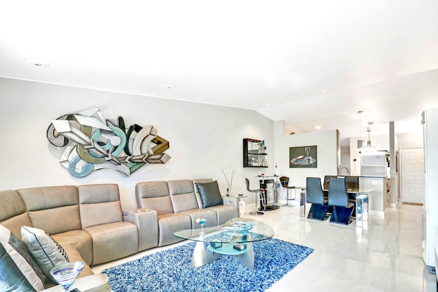 living room featuring vaulted ceiling