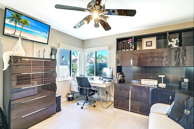 office area with ceiling fan and light tile patterned floors