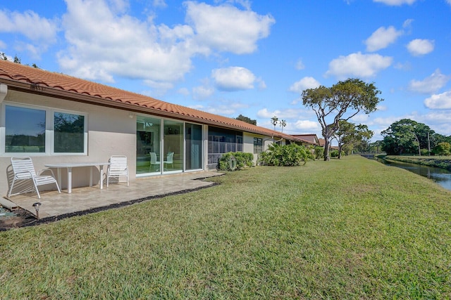 6140 Kings Gate Cir, Delray Beach, FL 33484 - view of green lawn featuring a patio area
