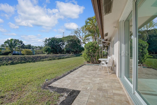 6140 Kings Gate Cir, Delray Beach, FL 33484 - view of green lawn with a patio area