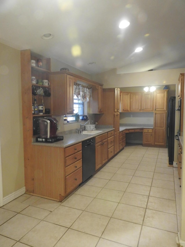 kitchen with sink, light tile patterned floors, and black dishwasher