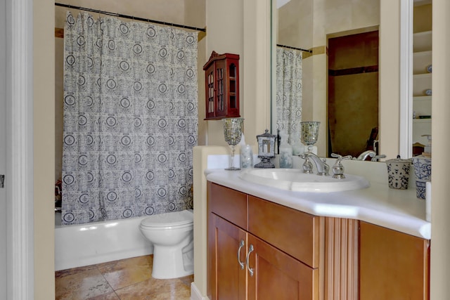 full bath featuring vanity, shower / bath combo with shower curtain, and toilet