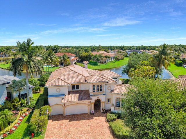 birds eye view of property with a water view and a residential view