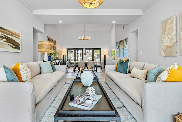 living room with crown molding and a chandelier