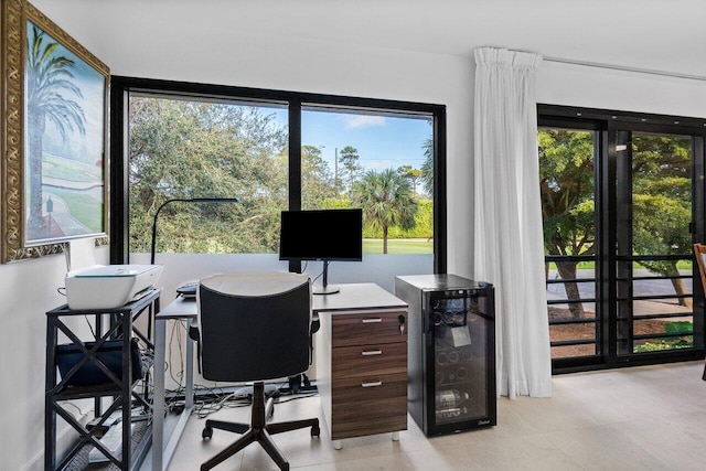 office space with light tile patterned flooring and wine cooler