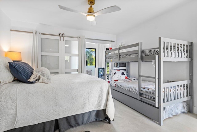 bedroom featuring ceiling fan and access to exterior