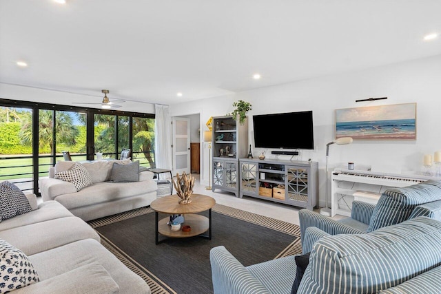 living room featuring ceiling fan and french doors