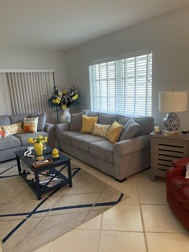 tiled living room with a textured ceiling