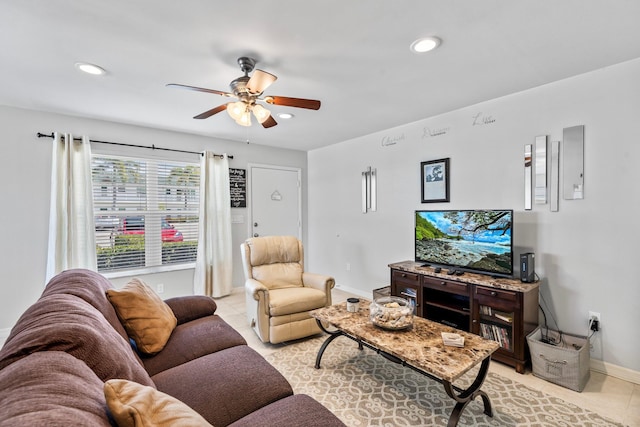 living room with ceiling fan and light tile patterned floors