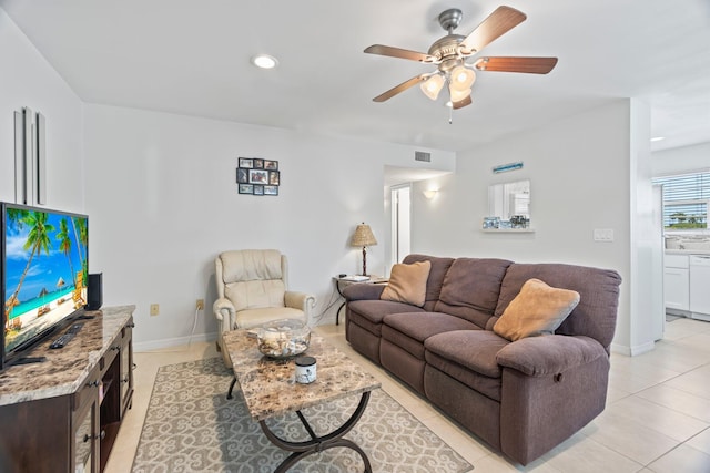 living room featuring ceiling fan and light tile patterned floors