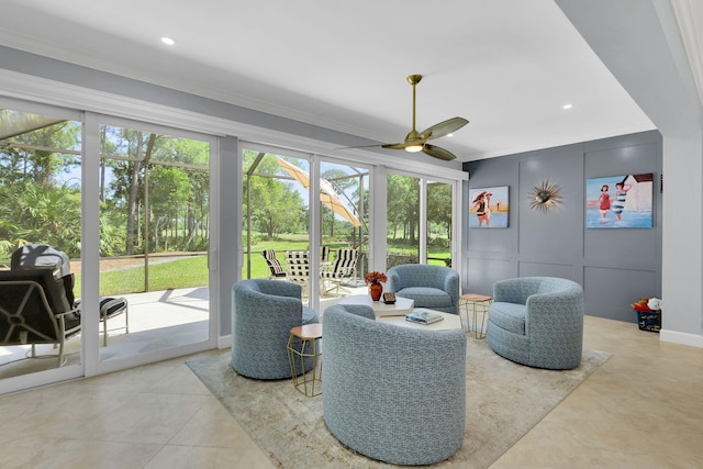 sunroom featuring ceiling fan