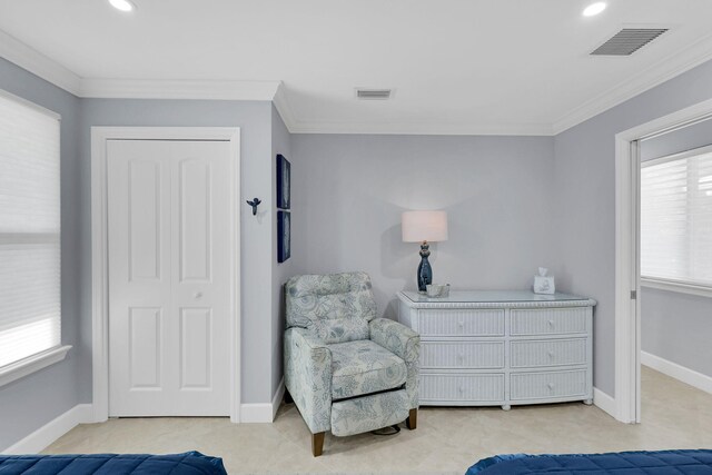 living area with crown molding