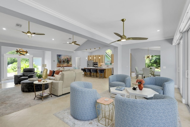 living room featuring vaulted ceiling and crown molding