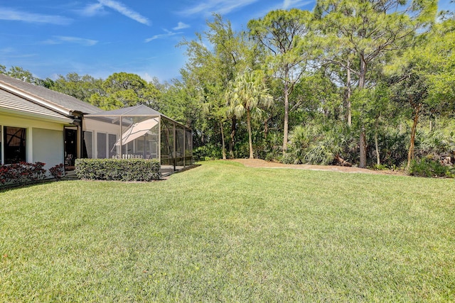 view of yard featuring a lanai