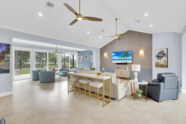 living room with lofted ceiling and ornamental molding