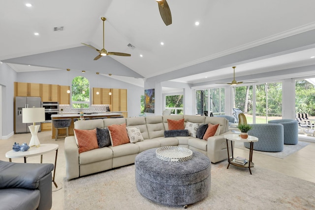 living room with lofted ceiling, ornamental molding, and light tile patterned floors