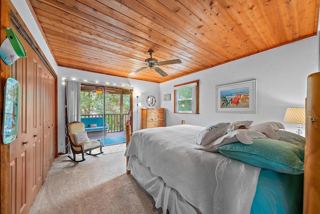 bedroom with access to outside, light colored carpet, ceiling fan, wooden ceiling, and a closet