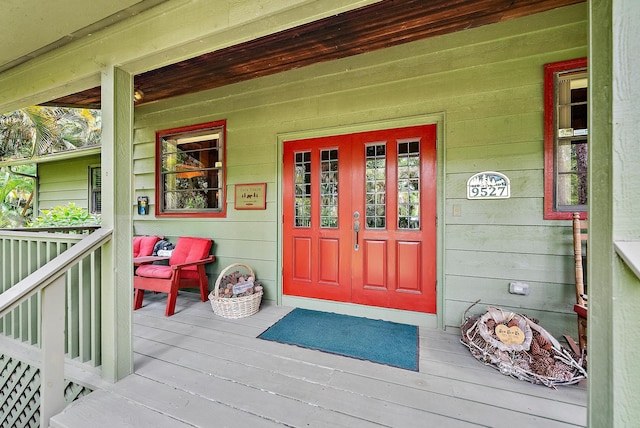 view of exterior entry featuring a porch