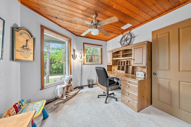 carpeted office space featuring ceiling fan and wooden ceiling